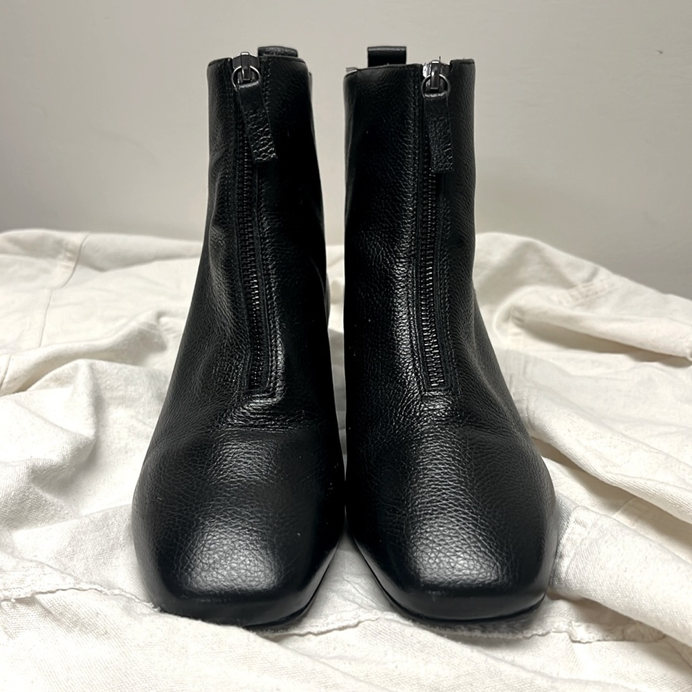 Black, front zip, leather booties with small heel.Size 39.Worn once